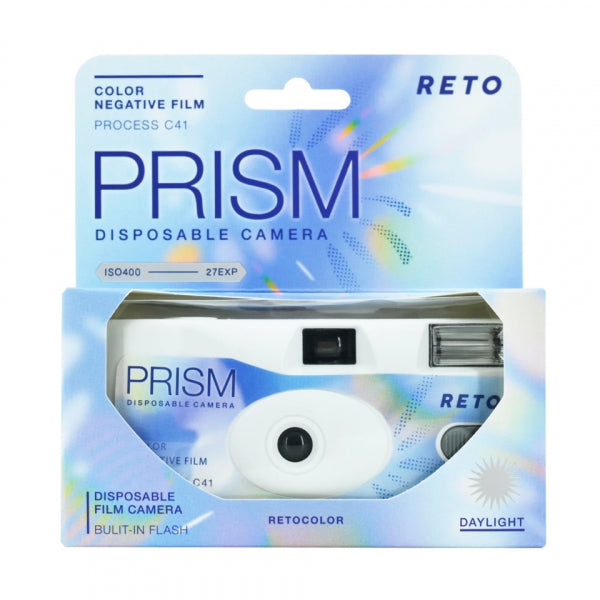 Prism Disposable Camera in its original packaging, featuring a white camera inside a light blue and iridescent box with 'RETO PRISM' branding.