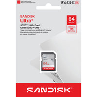 Sandisk Ultra 64GB SDXC UHS-I memory card in its retail packaging, featuring a white and red card with a clear window showing the card inside.