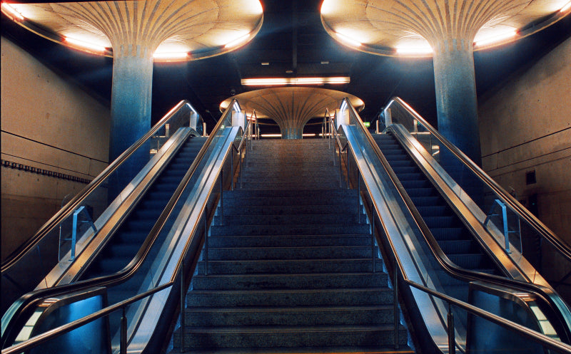 Staircase with escalators in a subway or transit station setting