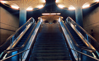 Staircase with escalators in a subway or transit station setting