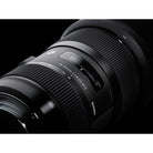 Sigma camera lens on a black background