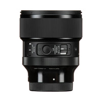 A close-up studio shot of a black Sony lens control ring on a camera lens, showing the AF-LCS, AF-M, AF-Q, and AF-S modes, with '50MM(1.79FEET-∞)' and 'MADE IN JAPAN' printed on the front.