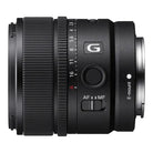 Camera lens with focus and aperture controls on a white background