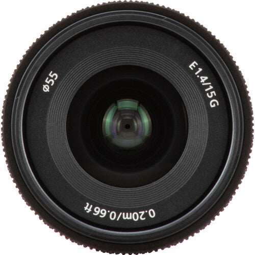 A close-up studio shot of a black Nikon AF-S DX NIKKOR 18-55mm f/4G lens, showing the front glass elements, textured focus ring, and white printed specifications including 'E1.4/1.
