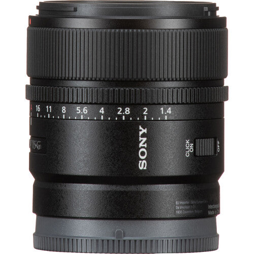 Sony 24mm f/1.4G lens in black with white markings and a silver focus switch, shown on a white background.