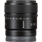 Sony 24mm f/1.4G lens in black with white markings and a silver focus switch, shown on a white background.