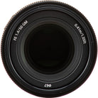 Close-up of a camera lens with technical specifications on a white background