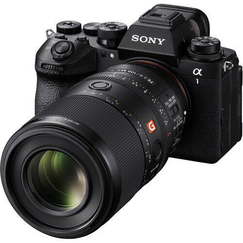 Sony camera with large macro 100mm lens on a white background