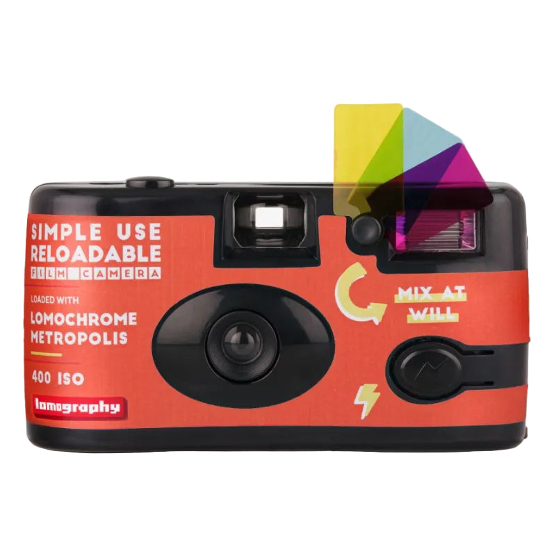 Red camera with colorful lens shade on a white background