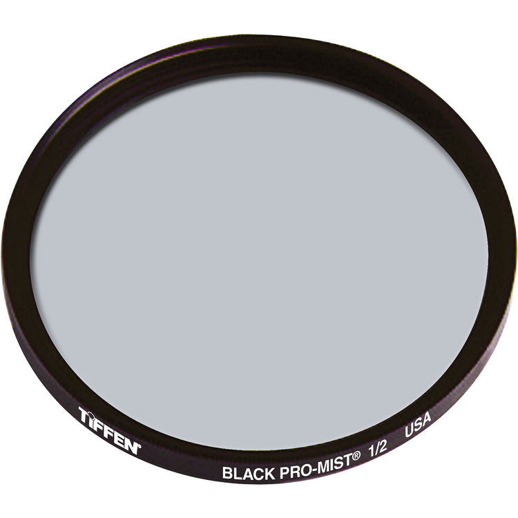 A Tiffen Black Pro-Mist 1/2" circular camera lens filter with a dark metallic rim and a gray glass center, shown on a plain white background.