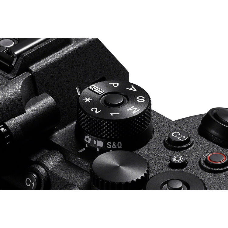 Close-up of a camera control panel with various buttons and dials.