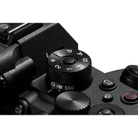 Close-up of a camera control panel with various buttons and dials.