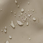 Textured beige surface with 'JURTH' branding and water droplets.