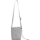 Small gray crossbody bag with a strap on a white background