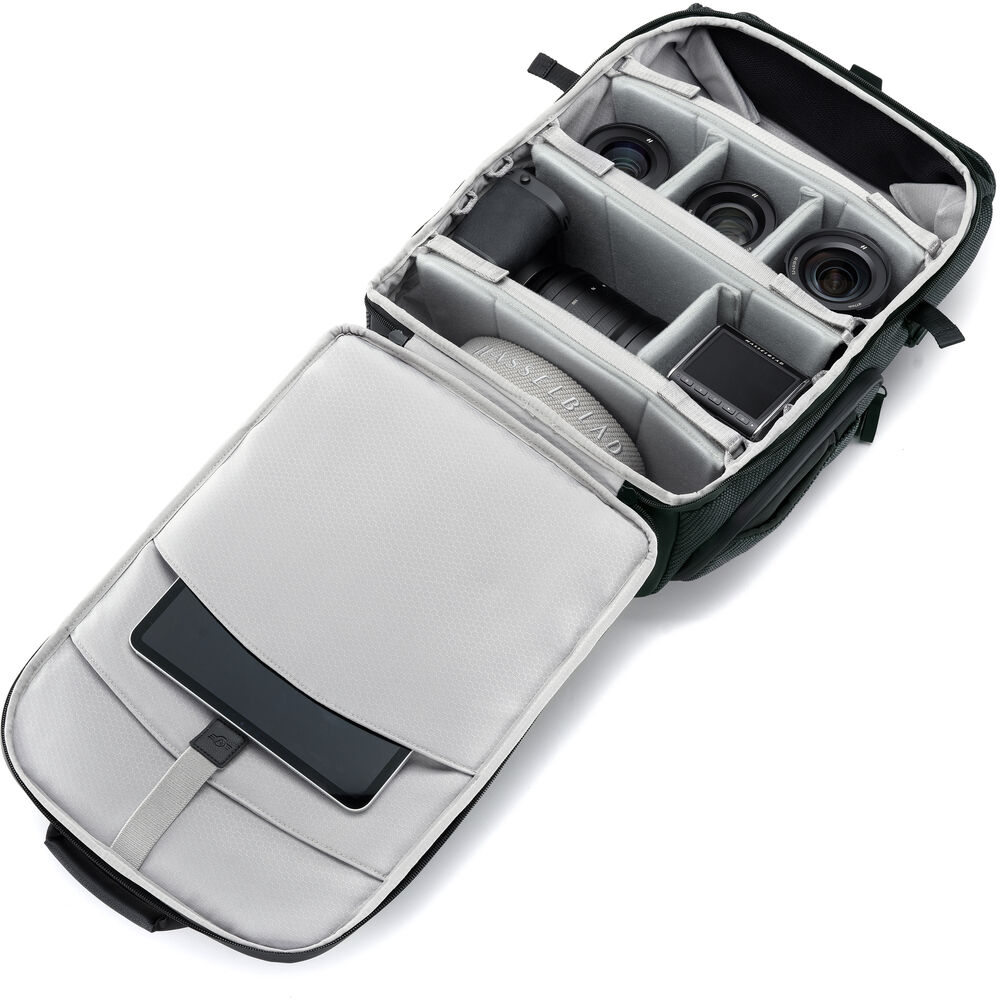 Open camera case with compartments on a white background
