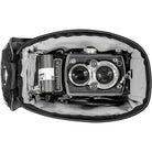 Vintage Rolleiflex camera inside a black leather case on a white background