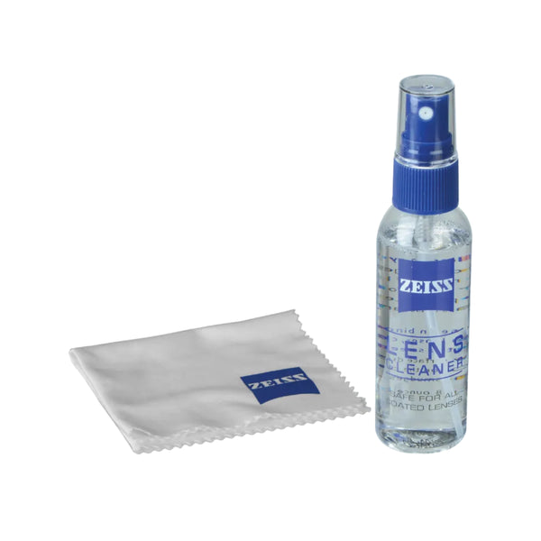 Zeiss lens cleaning spray bottle and cloth on a white background