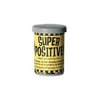 A canister of FPP Super Positive 35mm black and white film with yellow and black labeling, indicating it is a unique BW positive film with ISO 0.8 and 24 exp.