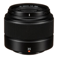 A black FUJIFILM Fujinon XC35mmF2 lens with focus and zoom rings visible.