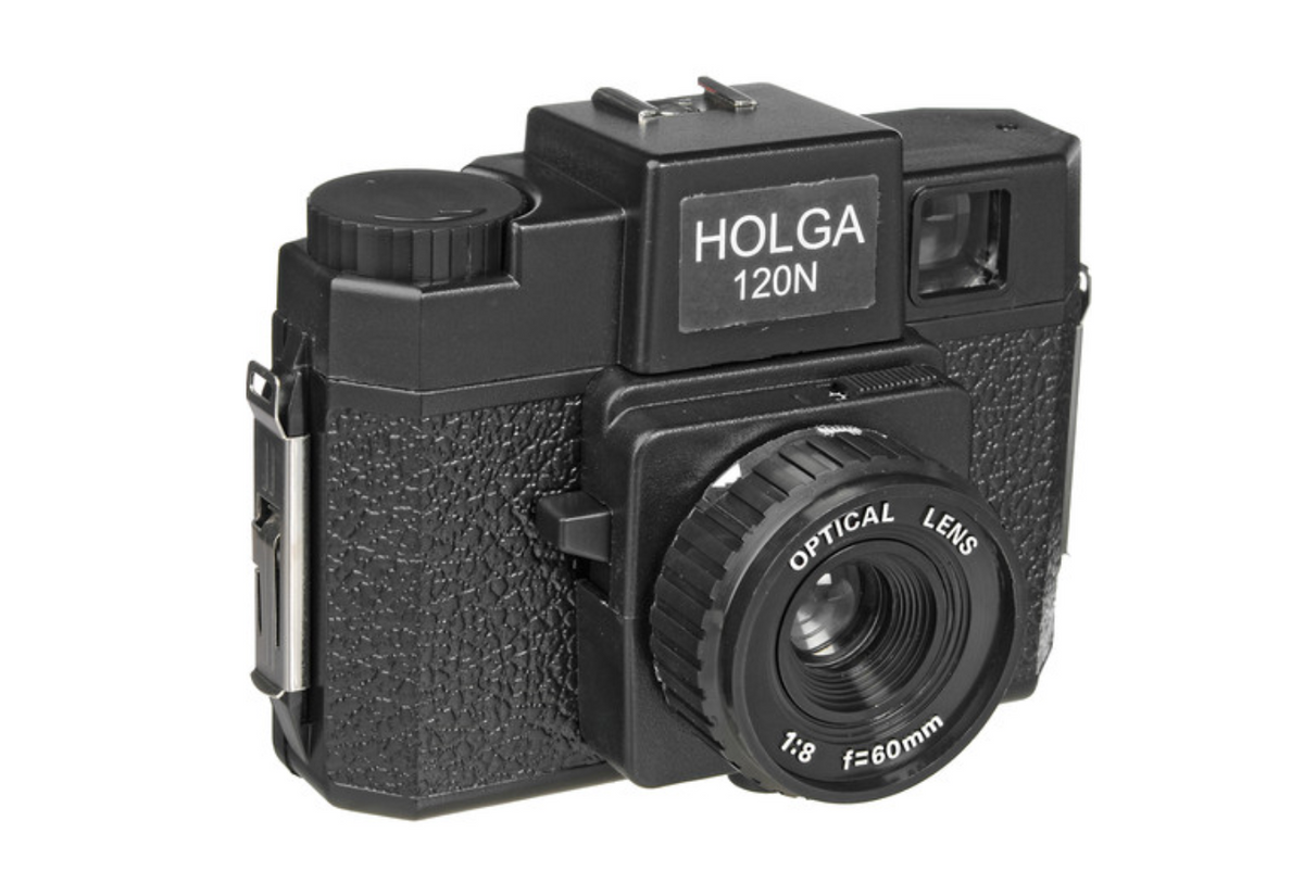 Black Holga 120N medium format toy camera with a textured plastic body and 60mm f/8 optical lens against a white background.