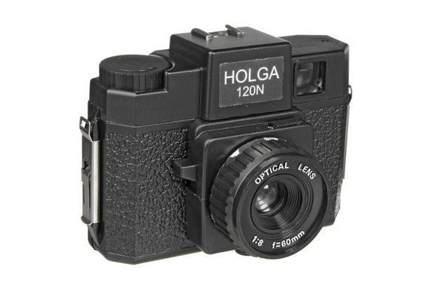 Black Holga 120N medium format toy camera with a textured plastic body and 60mm f/8 optical lens against a white background.