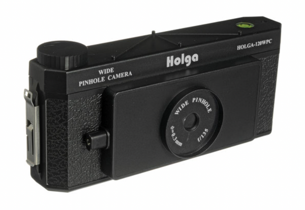 Black Holga 120 wide-angle pinhole camera with a textured body, top bubble level, and front lens aperture markings.