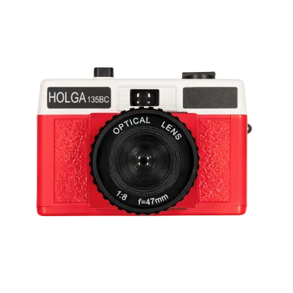 A red and white Holga 135BC 35mm film camera with a black lens, viewfinder, and flash attachment on a white background.