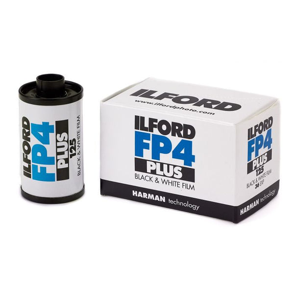 ILFORD FP4 plus black & white film canister and packaging box with branding and product information.