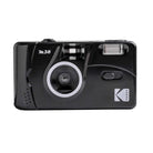 Black Kodak plastic camera with white M38 printed on it with white background