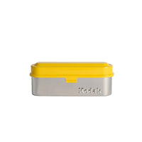 Kodak metal box with yellow lid on a white background