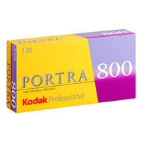 A single roll of Kodak Portra 800 120 color film in yellow, purple, and white packaging.