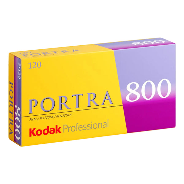 A single roll of Kodak Portra 800 120 color film in yellow, purple, and white packaging.