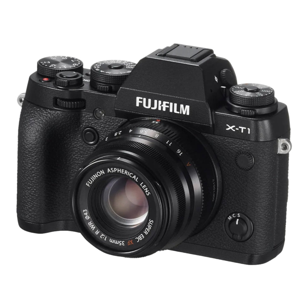 Fujifilm X-Ti mirrorless camera body with a black lens, shown from a three-quarter angle on a white background.